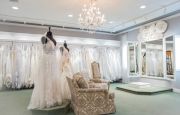 The main bridal gallery includes comfortable seating, an eye-catching display, large mirror and podium.