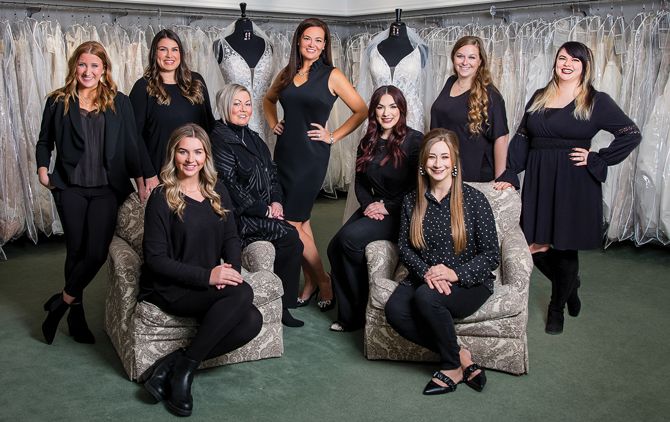 The Sarah's Bridal Gallery staff: (Front, sitting in chairs L to R) Elli Liechty, Sidney Garrett. (Back, L to R): Evelyn Peck, Allie Liechty-Hultman, Deb Canby, Owner Sarah Lauer, Allivia Moore, Jamie Waterhouse, Brittany Walker.