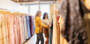 Stylist Sadee assisting a bride in selecting her bridesmaids’ dresses. 