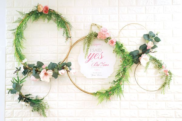 All brides take photos in front of the store’s famous “I SAID YES!” wall after making a gown purchase at Bri’Zan Couture.