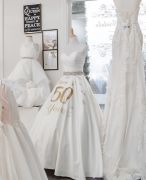 A 50th anniversary dress greets brides and 
reminds of history.
