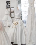 A 50th anniversary dress greets brides and 
reminds of history.