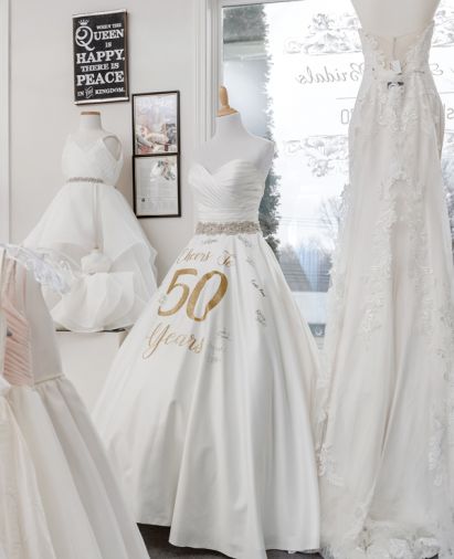 A 50th anniversary dress greets brides and 
reminds of history.