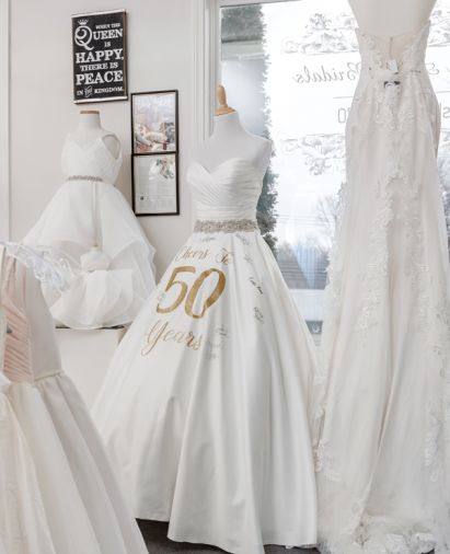 A 50th anniversary dress greets brides and 
reminds of history.