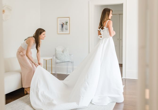 Co-owner Mallory Thorburn styles The White Magnolia Atlanta bride Madison in one of the boutique’s private bridal suites.