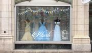 Blush Bridal and Formal in Bangor, Maine, focuses on incorporating playful props to create stories in window displays. Recently to kick off summer, the store cut up a pool noodle to create popsicles and ice cream cones.