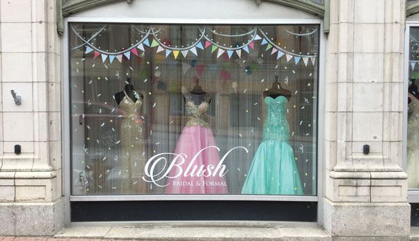Blush Bridal and Formal in Bangor, Maine, focuses on incorporating playful props to create stories in window displays. Recently to kick off summer, the store cut up a pool noodle to create popsicles and ice cream cones.