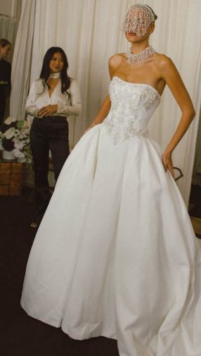 Spring 2027 gowns take center stage at event.