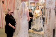 Paula Roberts, bridal consultant at The Bridal Suite of Louisville, helping a bride.