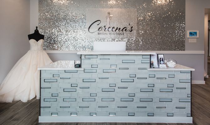 The shimmering wall of sequins behind the checkout desk at Coreena’s Bridal Boutique sees brides off with some glamour.