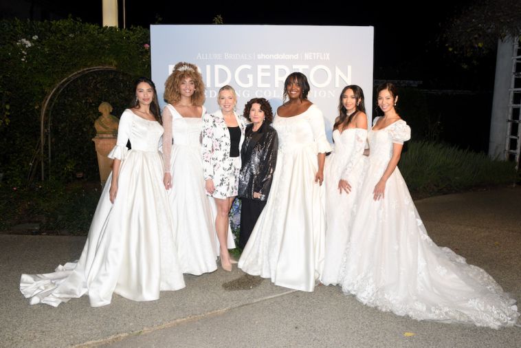 Allure Bridals Global Brand Director Nikki Deeds (3rd from L) and Emmy award-winning costume designer Lyn Paolo (4th from R) attend the Allure Bridals Bridgerton Wedding Collection launch event. (Photos by Vivien Killilea/Getty Images for Allure Bridals)