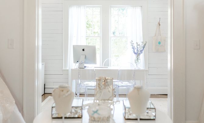 A glimpse from The White Magnolia Atlanta’s gown room into its reception area.