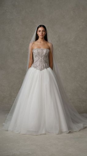 Divina: Strapless ball gown featuring a fully crystal-embellished corset bodice with a mini basque waist and full layered tulle skirt.