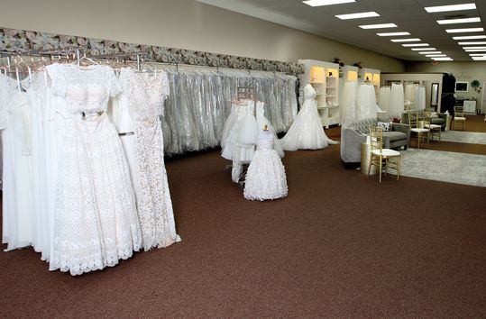Post-renovation, Aurora Bridal’s updated accessory area and lighter walls/area rugs give a much brighter, softer feel.