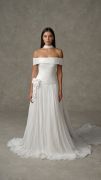 Florina: Off-the-shoulder chiffon gown with a softly draped bodice, dropped waist, and pleated A-line skirt. Finished with dimensional floral appliqu&eacute; at the hip and a coordinating chiffon scarf.