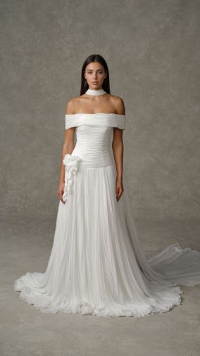 Florina: Off-the-shoulder chiffon gown with a softly draped bodice, dropped waist, and pleated A-line skirt. Finished with dimensional floral appliqu&eacute; at the hip and a coordinating chiffon scarf.