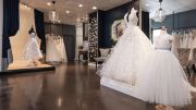 The main retail space at Francesca s Bridal, highlighting several gowns.  We love how the dark
background really shows the wedding gowns,  owner Francesca Ripple says.