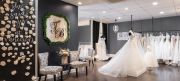 Brides sign wooden flowers with their name and wedding date and put it on the store&rsquo;s &ldquo;Said Yes&rdquo; wall. When they pick up their dress, that flower is handed back to them in a window gift box.