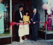 (Left) Ribbon-cutting ceremony with Mayor Robert Shaw on July 1, 1986. (R) Brian and Renee toast their new adventure.