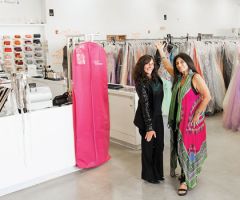 Owners of the building and The Ultimate, Fawn Merlino and Heather Siegel, in the middle of the 10,000-sq-ft store filled with more than 20,000 dresses.