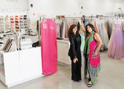 Owners of the building and The Ultimate, Fawn Merlino and Heather Siegel, in the middle of the 10,000-sq-ft store filled with more than 20,000 dresses.