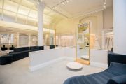 Without sacrificing visibility, the main salon at Kleinfeld is sectioned with plexiglass dividers and wooden partitions.