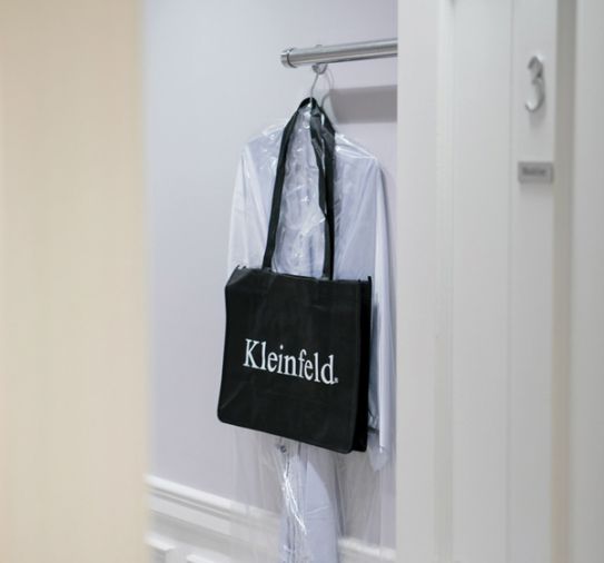 At Kleinfeld, brides are given tote bags to store their clothes, and a silk robe to use while trying on gowns.