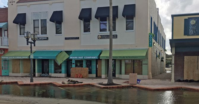 Ashley Sipos, owner of Lola Grace in Daytona Beach, Fla., boarded up her store’s windows, placed sandbags at the doors, unplugged and packed electronics and moved everything to the center of her showroom in preparation for Hurricane Irma.