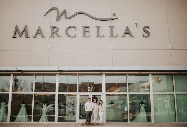 Marcella’s Bridal co-owners (and family!) Craig Davis, Marcella Davis and Kassi Neubauer in front of their Spokane, Wash. boutique.­