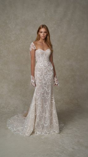 Odette: Strapless fit-and-flare gown featuring a soft sweetheart neckline, structured bodice, and all over dimensional embroiderd lace with scallop detailing.