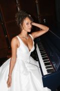 One of 17 gowns moving through the intimate NY 
jazz club.