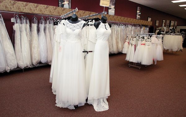 Prior to its renovation, Aurora Bridal featured dark walls, which contributed to an overall dated look. Toward the back are black counters for the old tuxedo area.