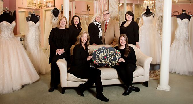 The Bridal Suite of Louisville staff: (L to R, standing): Paula Roberts, Sara Rodriguez, Laurie Robertson (owner), Terence Robertson (owner), Rachel Williams (manager).
(L to R seated): Jan Friebert, Libby Lawson (asst. manager). Missing: Ally Sebian, Wesley Ware.