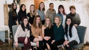 Some of the members of the Miss Ruby team photographed at a recent holiday charity giving staff meeting where they broke into teams and shopped for various organizations in the Milwaukee area.