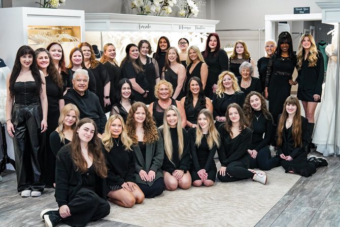 The Bridal & Formal staff. Middle row, from left: Owners Andy Star, Lisa Star (third from left) and Daniella Star (fourth from left). General Manager Tina Minshall is next to Daniella, fifth from left.