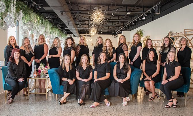 The Wedding Shoppe team (Back, L to R): Stacey Palmer, Geena Wells, Katy Lorkowski, Brittany Ustick, Marina Larocque, General Manager Danielle Simone, Owner Michelle McFarland, Ashlee Reynolds, Melissa Maybee, Manager Rebecca Miller, Christina Tomlinson, Alterations Manager Codi Arnone, Shawn Spears-Vilk. SEATED: Cheri Tucker, Danielle Konaszewski, Jamie Sowers, Erika Stewart, Rita El-Hadi, Jessica Stowinsky, Sales Manager Haley Guyot. Missing: Elisa Colon, Kim DeVaughn, Van Champlin, Alie Miller, Haley Cavanaugh, Riley McFarland, Ally Schoenherr, Nicole Wright.