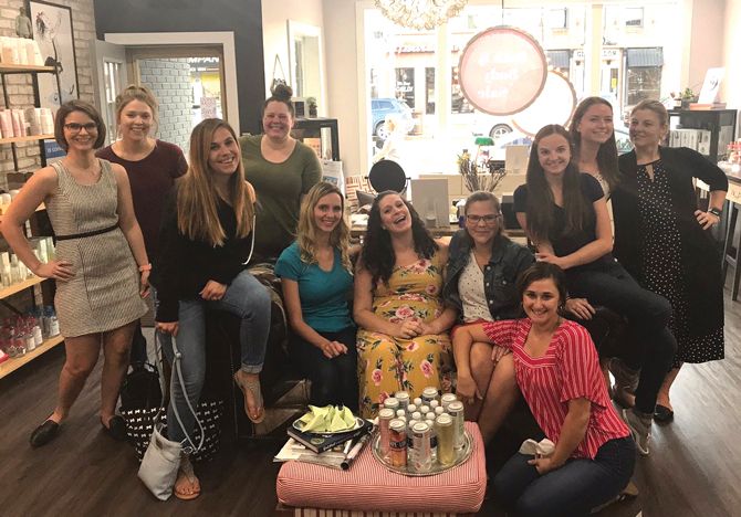 Staff members at The White Dress attend an after-hours team building event at a local beauty salon.