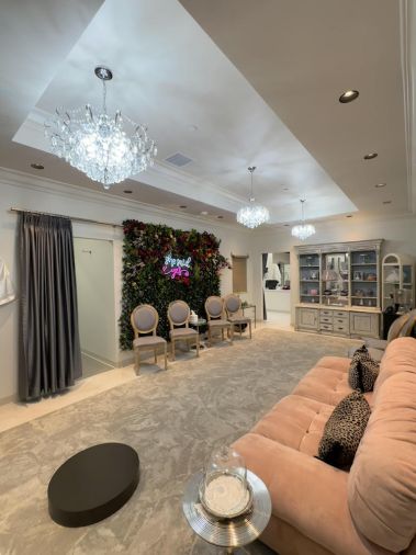 Elegant fitting areas feature plush seating, full-length mirrors, and luxurious design details.