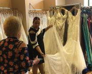 Many boutiques leveraged technology to conduct pre-appointment meetings or virtual appointments. At Albuquerque, N.M.-based Uptown Bride, stylist Aliyah (right) takes a bride through a virtual appointment while her colleague, Karen, holds the computer. (Courtesy of Uptown Bride)