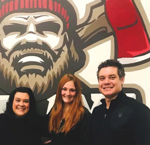 A team bonding event at an axe-throwing bar attended by staff at Wedding Shoppe in St. Paul, Minn.