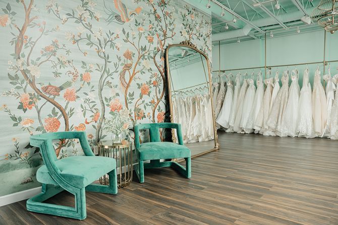 Sposa Mia’s Yes to the Dress area features a colorful, eye-catching wallpaper backdrop to contrast against bridal gowns.
