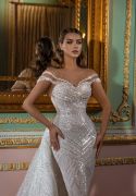 The Sun Dress from Dovita Bridals’ Galaxy 2023 collection, features elegant heart-shaped neckline that folds into embroidered lace skirt adorned with Swarovski crystals.