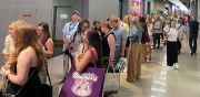 Buyers line up for standing room-only fashion show.