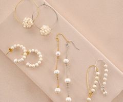 Novia s wedding jewelry collection includes pearl earring sets available in silver and gold.